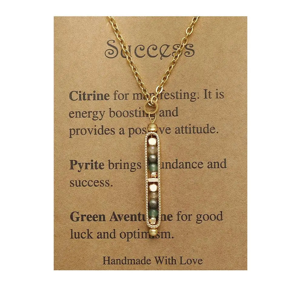 Gold pendant necklace featuring natural stones: Citrine, Pyrite, and Green Aventurine, symbolizing success and positivity.