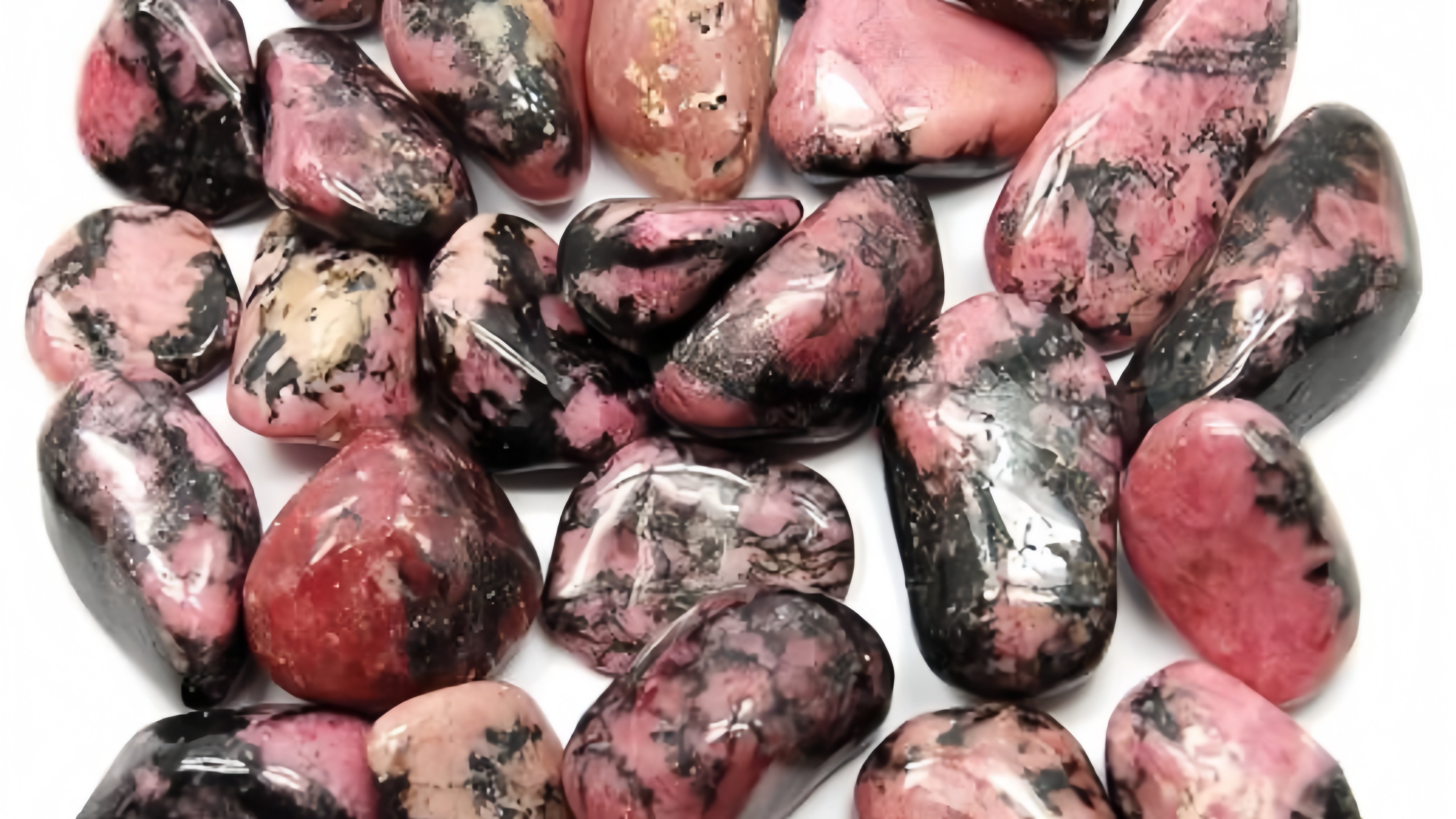 Rhodonite crystal for love & healing. Boost confidence, attract romance, and enhance emotional balance with this powerful gemstone.